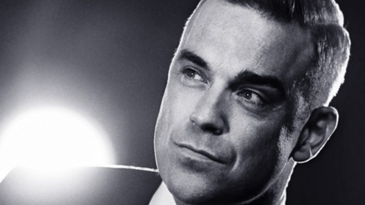 El inglés Robbie Williams se juntará a su banda Take That para un concierto benéfico.