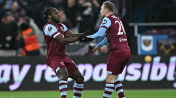 West Ham United's English midfielder #09 Michail Antonio (L) celebrates with West Ham United's English striker #20 Jarrod Bowen (R) after scoring the opening goal of the UEFA Europa League quarter-final second leg football match between West Ham United and Bayer Leverkusen at The London Stadium in east London on April 18, 2024. (Photo by Ben Stansall / AFP)